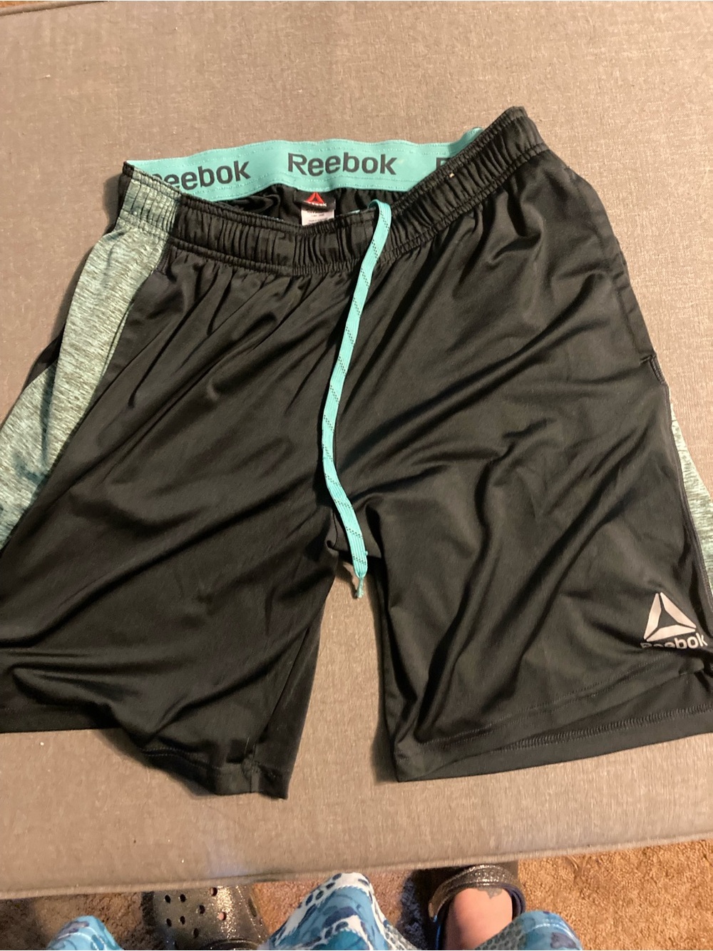 Reebok Men’s Black Athletic Shorts with Teal Accents